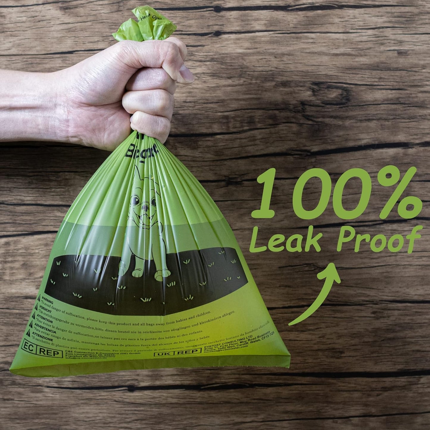 Strong 100 percent leak proof dog poop bag held in hand, durable green pet waste bag designed for safe and mess free cleanup