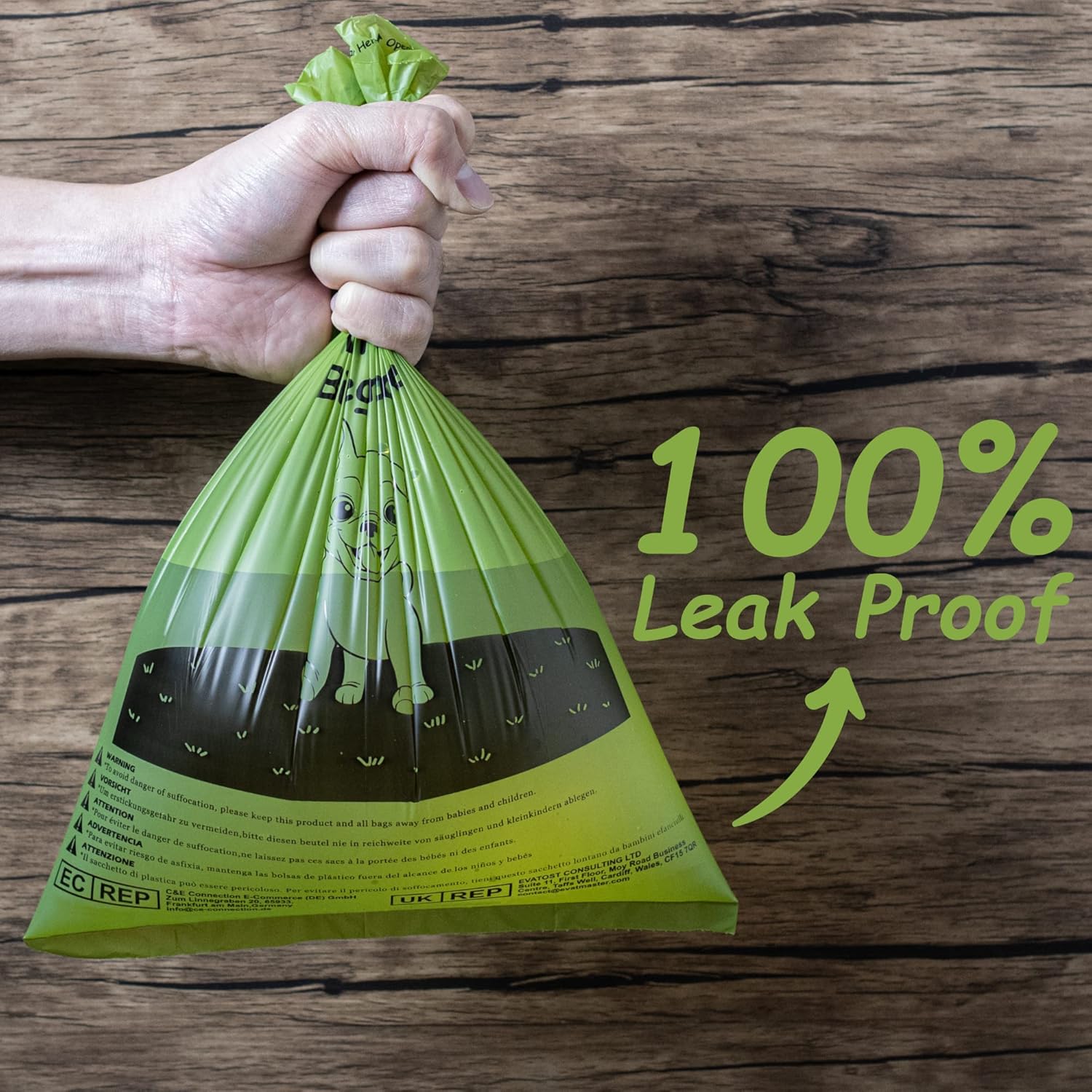 Strong 100 percent leak proof dog poop bag held in hand, durable green pet waste bag designed for safe and mess free cleanup